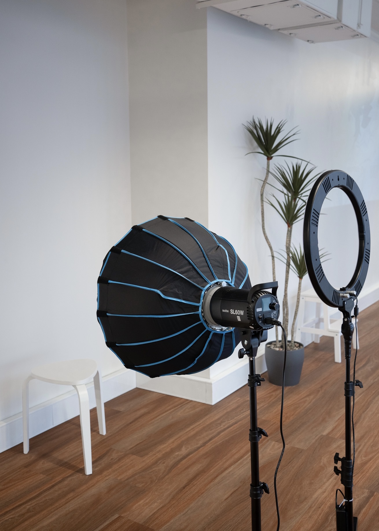 Studio lighting — softbox and ring light at a work station